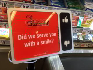 Did we serve you with a smile - sign at grocery store