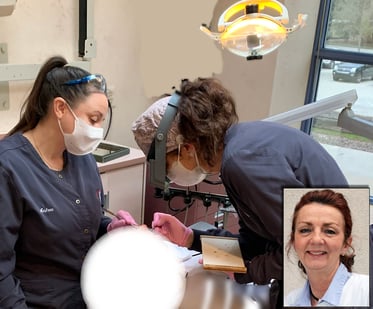 In this photo, Master Ceramist, Dental Lab Technician, Nancy puts the final touches on a Zirconia crown while Andrea assists. Matching the front teeth is a very complex and delicate procedure. Nancy uses stains and glazes to duplicate and blend any characterizations and color variations. After the crown is artistically perfected, it is fired in a porcelain kiln.